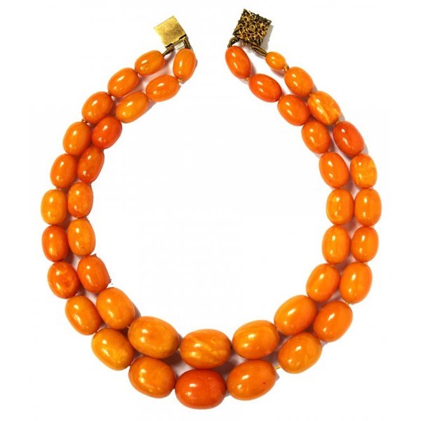 A NECKLACE OF AMBER BEADS Image