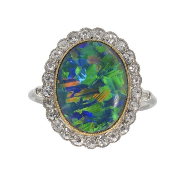 A BLACK OPAL AND DIAMOND CLUSTER RING Image